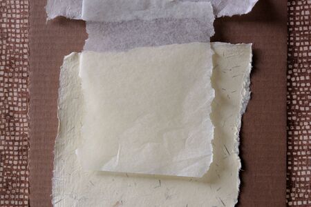 background collage of fabric, cardboard and textured papersの写真素材