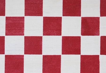 red stenciled checkerboard detail useful for a backgroundの写真素材