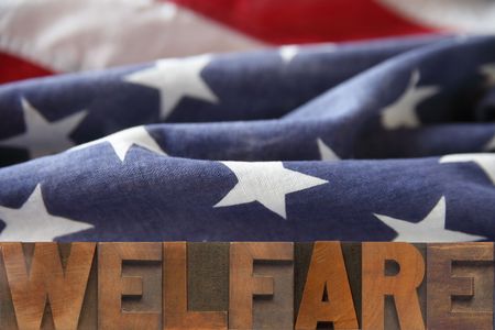 the word welfare on an American flag backgroundの写真素材