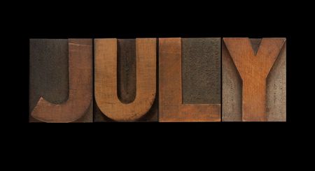 the word July in old letterpress wood typeの写真素材