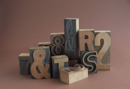 grouping of letterpress wood letters, numbers and symbolsの写真素材