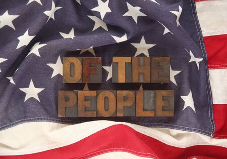 the words of the people on an old American flagの写真素材