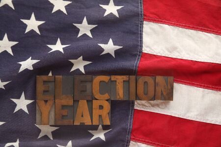 election year in old wood type on a USA flag