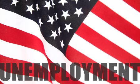 the word  unemployment  on a USA flag