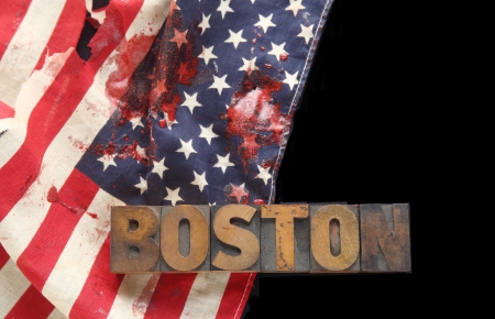 bloody American flag and the word Boston in old wood type on a black backgroundの写真素材