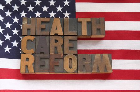 the words health care reform on an American flagの写真素材