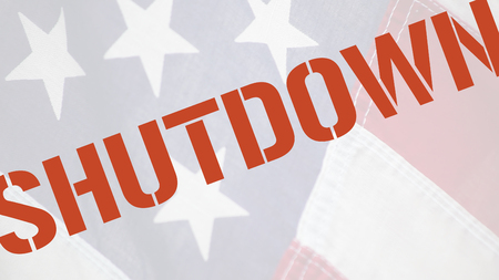 American flag with the word shutdown in red typeの写真素材