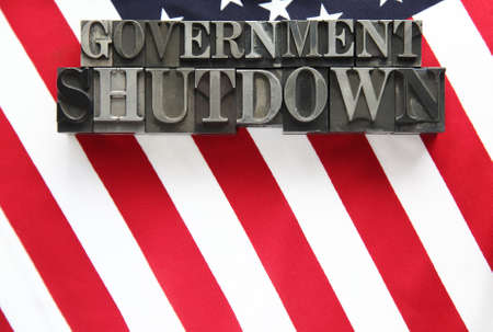 the words government shutdown on an American flagの写真素材