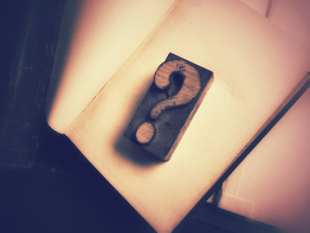 Letterpress wood type punctuation on blank pages of old book