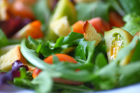Salad of various lettuces and baby heirloom tomatoes with croutonsの写真素材