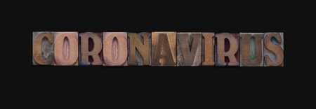 The word coronavirus in wood type letters
