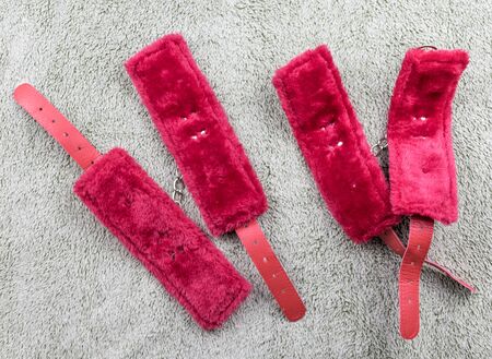 Red straps are handcuffs for love games.