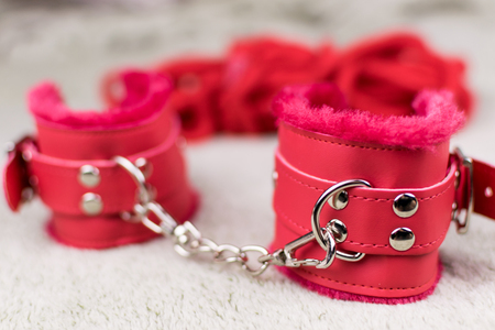 Red handcuffs for love games.の写真素材