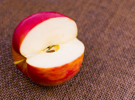 Apple cut on a dark brown background.の写真素材