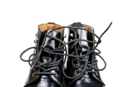 Black shoes with laces. Top part. Isolated on white background.の写真素材
