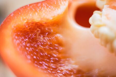 Macro of a lot of white seeds in light red tones. Bulgarian red pepper shot close-up.の写真素材
