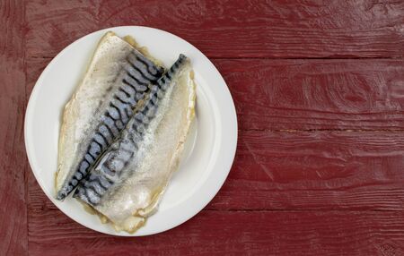Marinated fish (mackerel) on a white plate.の写真素材