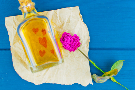 A love potion on paper with painted hearts.の写真素材