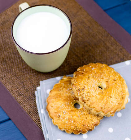 A cup of milk and cookies.の写真素材