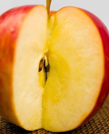 Apple cut on a dark brown background.