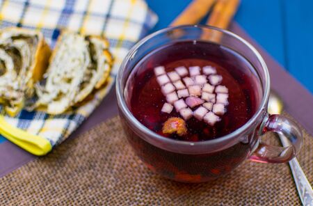 Fruit tea in a transparent cup. Tea made from dried fruits.