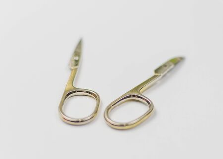 The concept of an unsuccessful manicure. Broken scissors.の写真素材