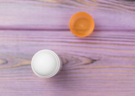 Female deodorant   on a wooden background.の写真素材