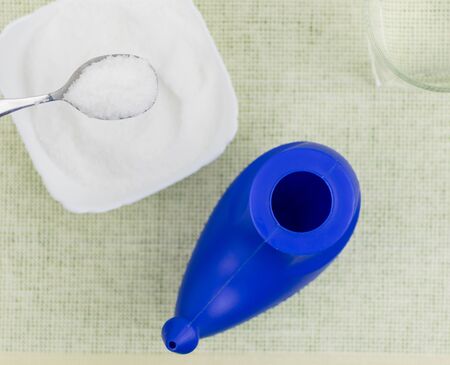 Device for washing the nose. Near the sea salt for the preparation of a solution for washing.の写真素材