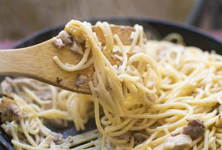Preparation of spaghetti with chopped meat in a frying pan.の写真素材