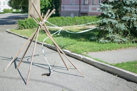 A fenced pit on the road.
