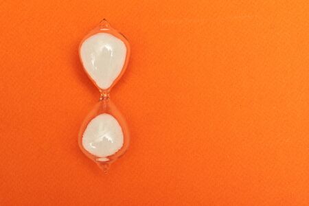 Hourglass in the doctor's hand. Medicine and time concept.の写真素材