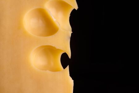 cheese close-up on a black background.の写真素材