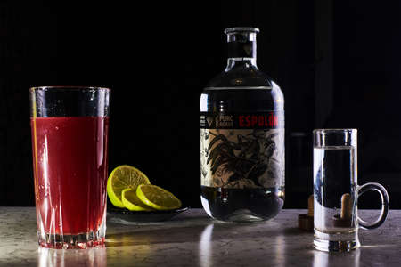 
Kiev, Ukraine - May 16, 2020: Closeup of Espolon Tequila made from 100% pure agave, blanco tequila bottle branding and a glass with juice and lime.のeditorial素材