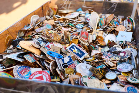 Riga, Latvia- February 06, 2020: Woman tourist with a camera chooses old icons in the market.のeditorial素材