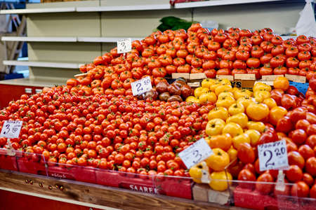 Riga, Latvia- February 06, 2020: Tomatoes in the city market.のeditorial素材