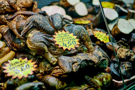 Riga, Latvia- February 06, 2020: Smoked meat products on the market counter.のeditorial素材