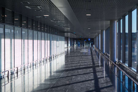 Riga, Latvia- February 06, 2020: a corridor with a glass wall at the airport.のeditorial素材
