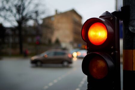 Traffic light red on a city street.