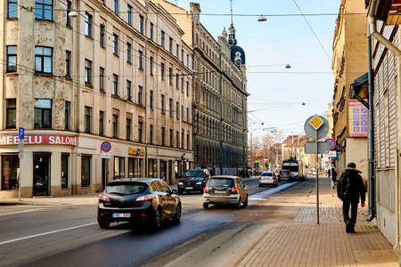 Riga, Latvia- February 06, 2020: Cars move on a road on a city street.