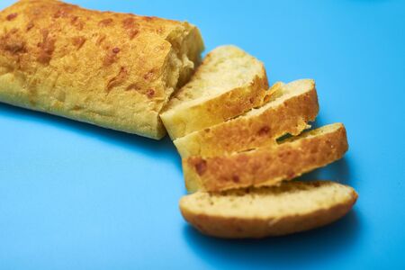 Sliced ciabatta on a blue background.の写真素材