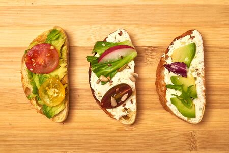 Ciabatta with cream cheese, avocado, various vegetables. Vegetarian sandwiches.