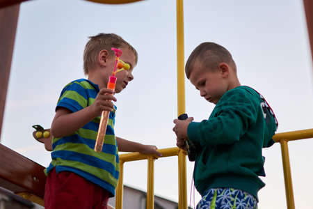 Gribovka, Odessa region - June 26, 2018: two boys met and played on vacation.