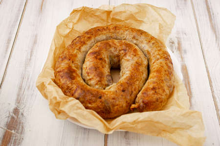 Homemade sausage made from natural meat on a plate.の写真素材