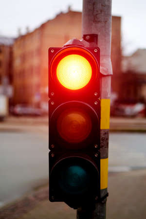 Traffic light red on a city street.