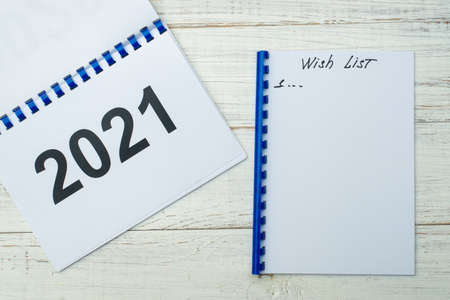 Wishlist for 2021 on a white wooden background.