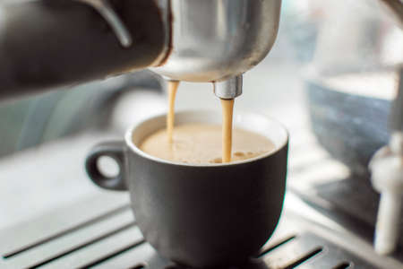 Preparing espresso in a coffee machine.の写真素材