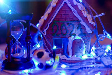 A lodge with the numbers 2021 and an hourglass in the lights of the lights.