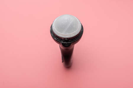 Roll-on deodorant on a pink background.の写真素材