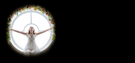 A woman 35-45 years old sits in a round window on a black background. She is wearing a white long...