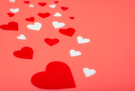 Hearts on a red background. Background for Valentine's Day, postcard.